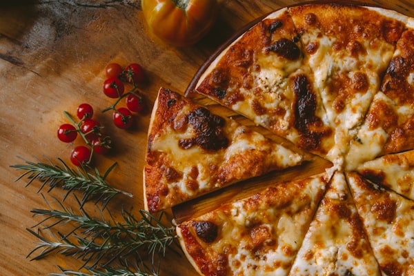 Fresh cheese pizza slice at Daisy's Pizza Longwood